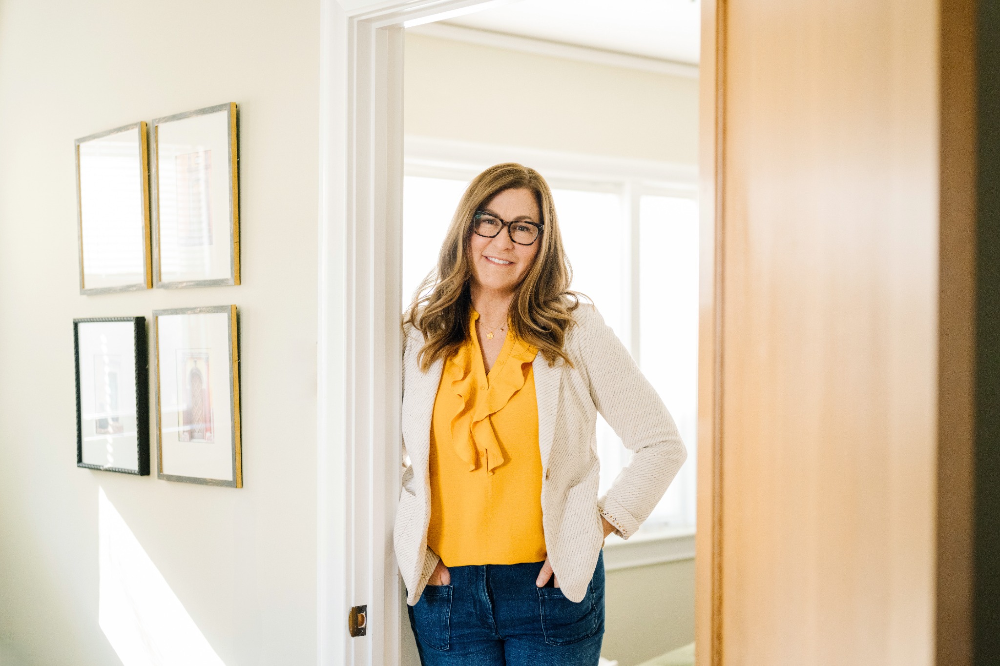 Nancy Thomas standing in the doorway of her office